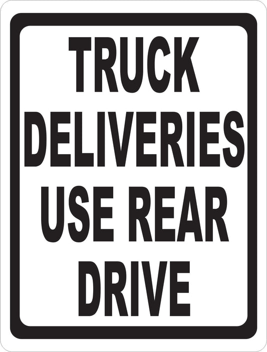 Truck Deliveries Use Rear Drive Sign