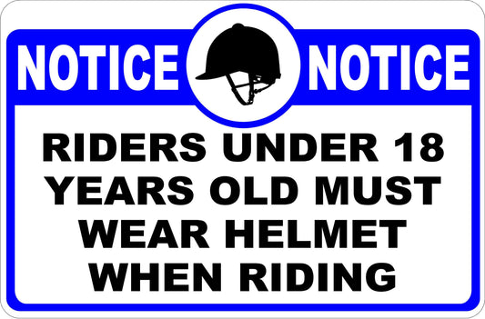 Sign with text 'NOTICE: Riders under 18 years old must wear helmet when riding' and a helmet icon.