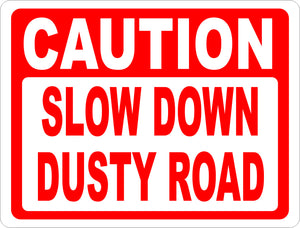 Caution Slow Down Dusty Road Sign